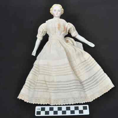 Ceramic doll with blue eyes and blond hair