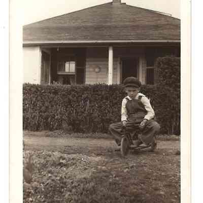 Harold McClellan Welsh on tricycle in front of house: IMG2025.026.001 (30)