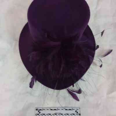 Purple felt church hat with purple feathers
