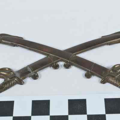 Stamped brass U.S. 1860 cavalry hat badge