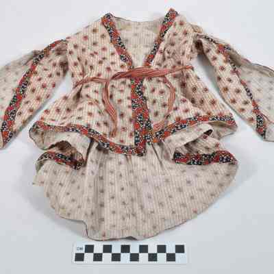 Doll dress with red circular designs