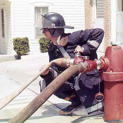 Firefighter at fire hydrant