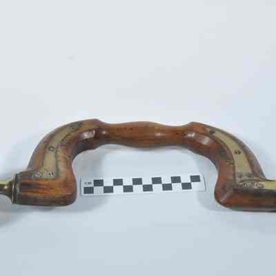 Wood and brass brace
