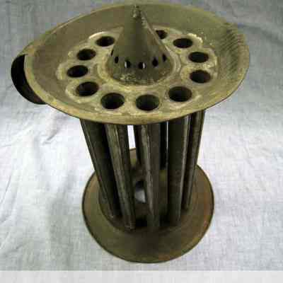 Tin eight-hole candle mold