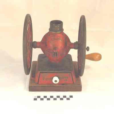 Cast iron coffee grinder on wood base