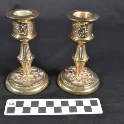 Two brass candlesticks made at the Badger-Powhatan Brassworks