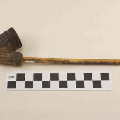 Clay pipe with wood stem