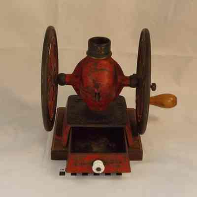 Cast iron coffee grinder on wood base