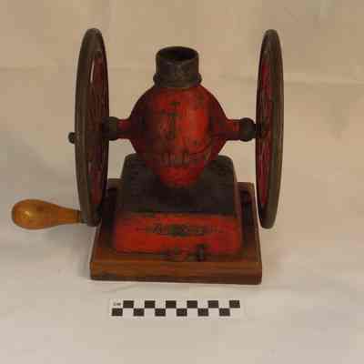 Cast iron coffee grinder on wood base