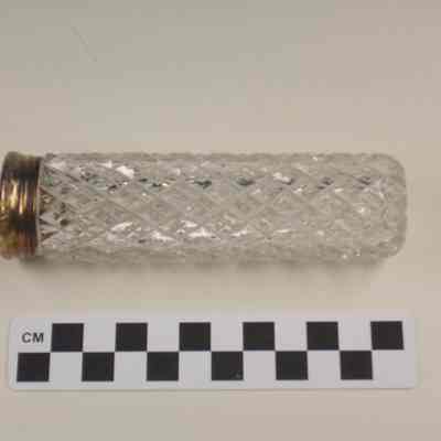 Cut glass bottle with gold washed cap