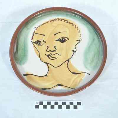Terra-cotta plate depicting African American woman