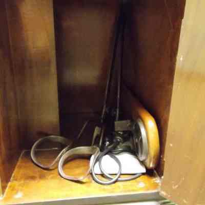 Items inside table cabinet (includes stirrups and stethescope).