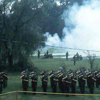 201st Field Artillery render salute with artillery pieces