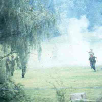 201st Field Artillery render salute with artillery pieces
