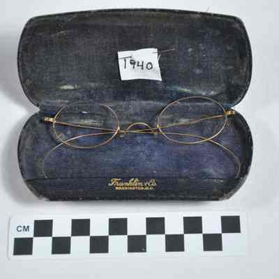 Gold, very thin wire-rimmed glasses and case