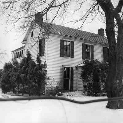 Halltown dynamite truck explosion - house with dark shutters showing broken windows