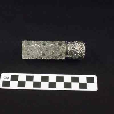 Cut glass perfume bottle with silver cap