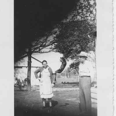 Dice & James Milton, in their backyard, with dog, Bounce - June 1, 1949