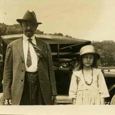 John Rosenberger posing in front of Hilltop House
