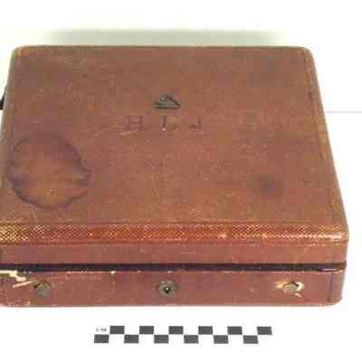 Square, brown-burgundy colored jewelry box