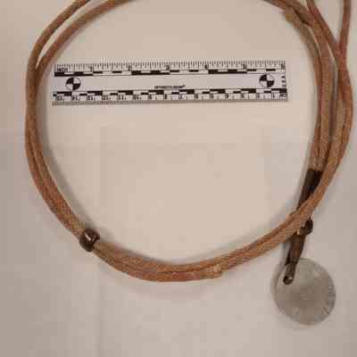 WWI circular aluminum id tag on cord