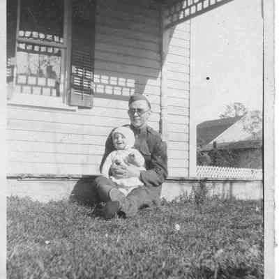 unidentified man holding John Edward Zombro, Jr.