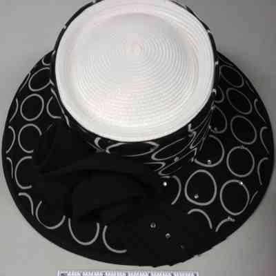 White straw church hat with black fabric and white circle pattern