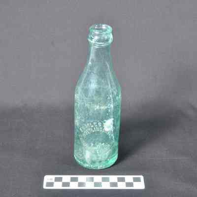 Green glass beverage bottle
