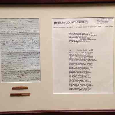 Two thin strips of brown wood said to be from John Brown's scaffold