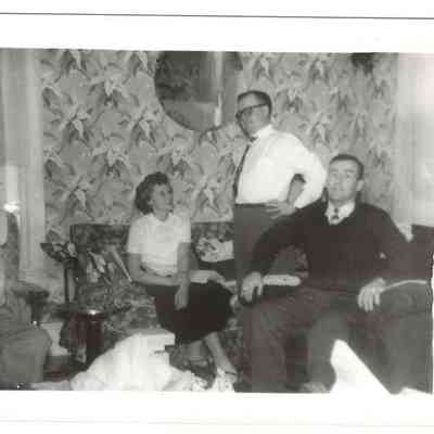 Interior of Welsh home in Bakerton, WV. From L to R: Martin D. Welsh, Sr., Dottie Welsh, Skeeter Welsh, and Harold "Skip" Welsh, undated: IMG2025.026.001 (20)