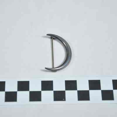Sterling silver pin in the shape of a crescent moon