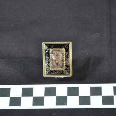 Mourning brooch with coiled strands of hair inside