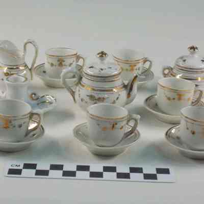 White china doll dishes trimmed with gold