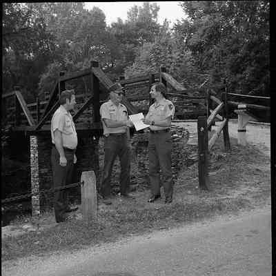 Superintendent Donald W. Campbell presenting an award to an unnamed NPS maintenance employee
