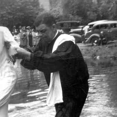 Rev. E. E. Baylor officiating at a baptism: IMG3441001
