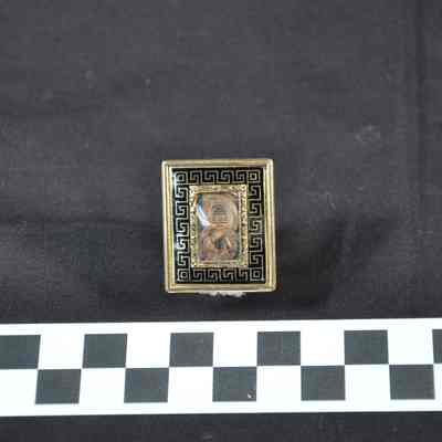 Mourning brooch with coiled strands of hair inside