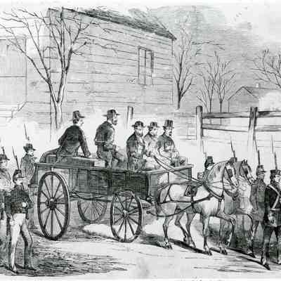 John Brown seated on coffin proceeding to execution site