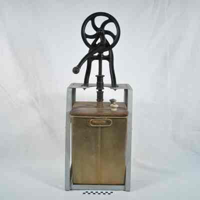 Iron, wood and tin butter churn