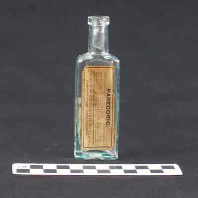 Clear glass light green pharmacy bottle