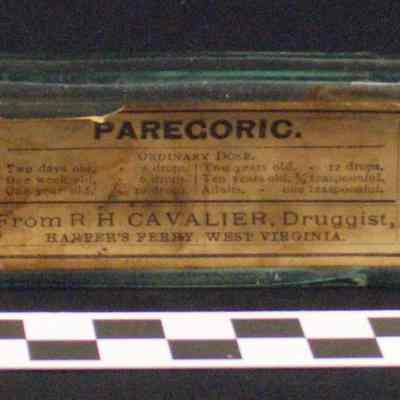 Clear glass light green pharmacy bottle label