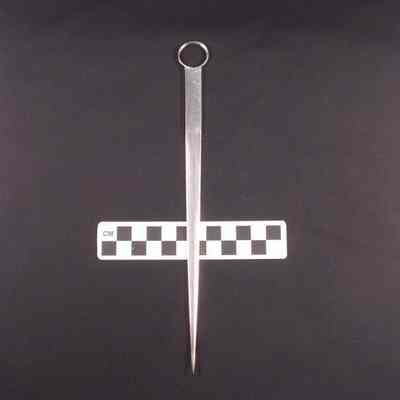 Silver meat skewer shaped like a dagger