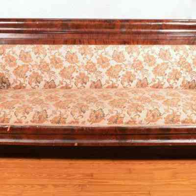 Large sofa with wood veneer covered frame