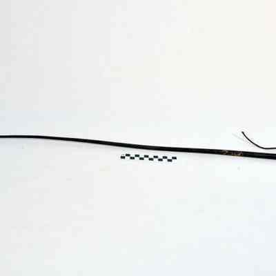 Tapered riding crop wrapped with a dark fabric