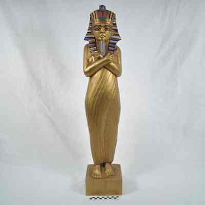 Painted wood carving of King Tutankhamun