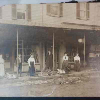 Employees in front of Grandstaff building