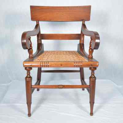Walnut armchair with caned seat