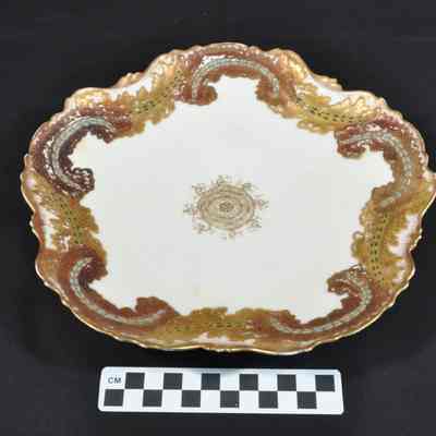 Cream porcelain plate with scalloped edge
