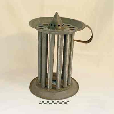 Round tin candle mold with 12 holes
