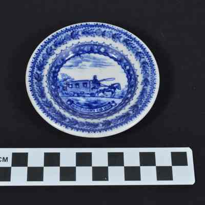 Blue and white china with horsedrawn railroad car in center