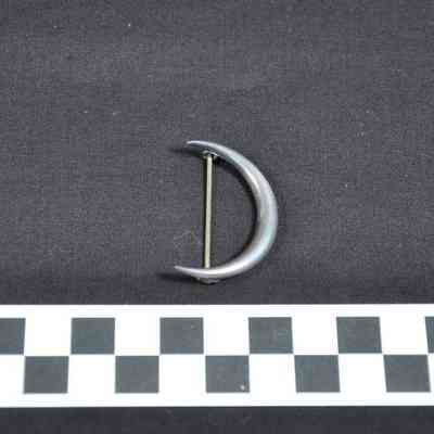 Sterling silver pin in the shape of a crescent moon